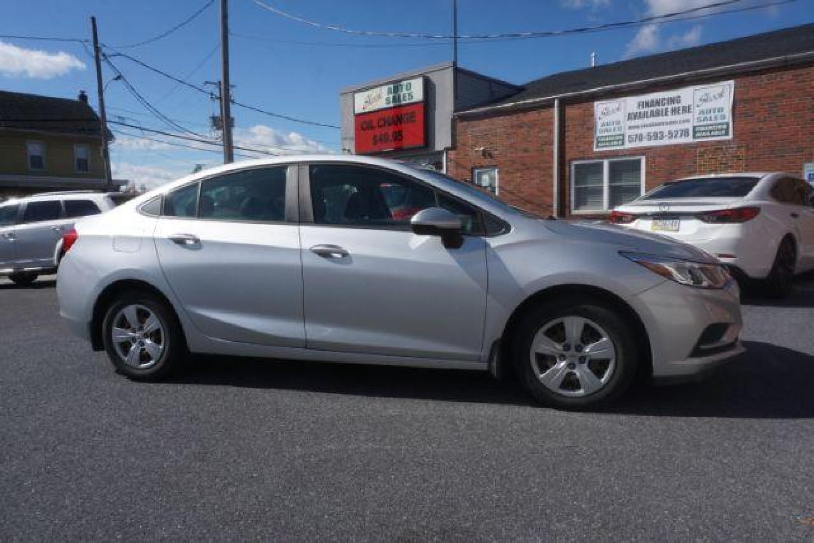 2018 Silver Ice Metallic Chevrolet Cruze LS Auto (1G1BC5SM7J7) with an 1.4L L4 DOHC 16V TURBO engine, 6-Speed Automatic transmission, located at 312 Centre Ave, Schuylkill Haven, PA, 17972, (570) 593-5278, 40.638130, -76.177383 - Photo#0