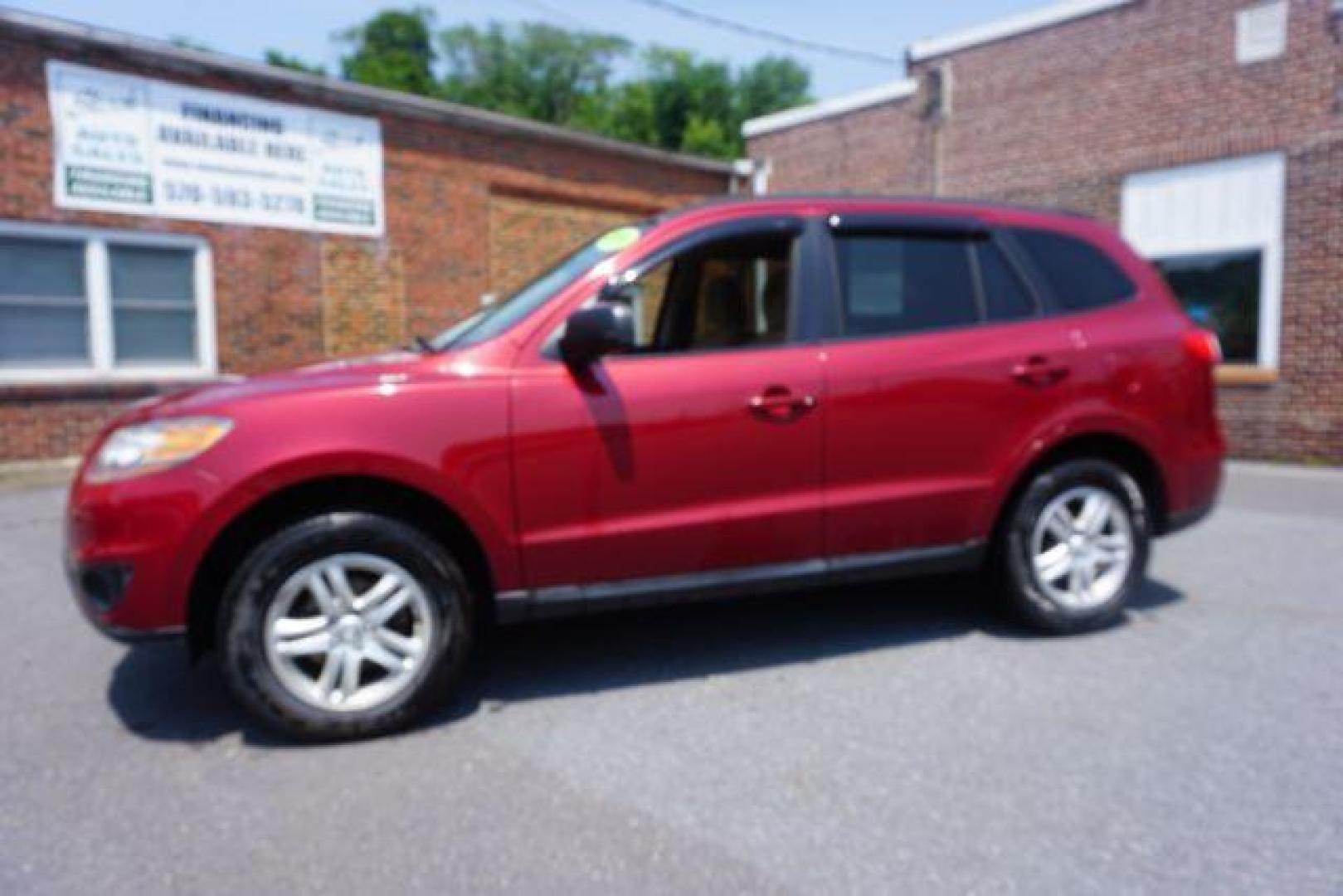 2011 Sonoran Red Hyundai Santa Fe GL 2.4 4WD (5XYZGDAB0BG) with an 2.4L L4 DOHC 16V engine, 6-Speed Automatic transmission, located at 312 Centre Ave, Schuylkill Haven, PA, 17972, (570) 593-5278, 40.638130, -76.177383 - Photo#0