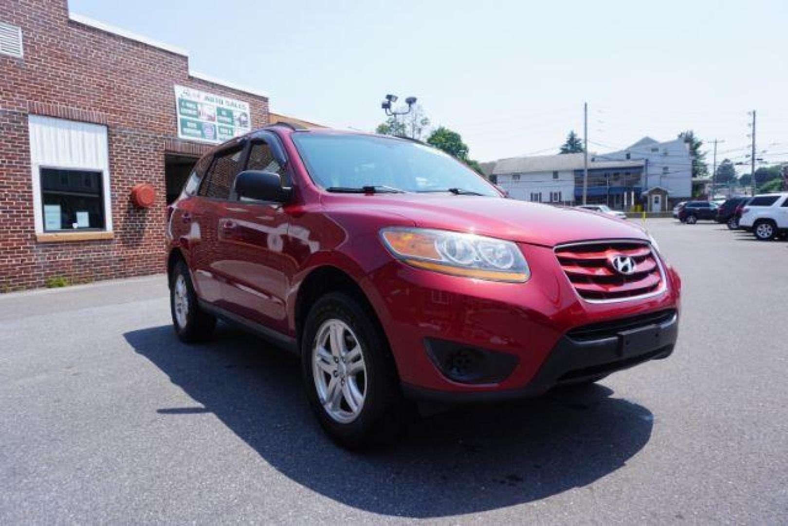 2011 Sonoran Red Hyundai Santa Fe GL 2.4 4WD (5XYZGDAB0BG) with an 2.4L L4 DOHC 16V engine, 6-Speed Automatic transmission, located at 312 Centre Ave, Schuylkill Haven, PA, 17972, (570) 593-5278, 40.638130, -76.177383 - Photo#5