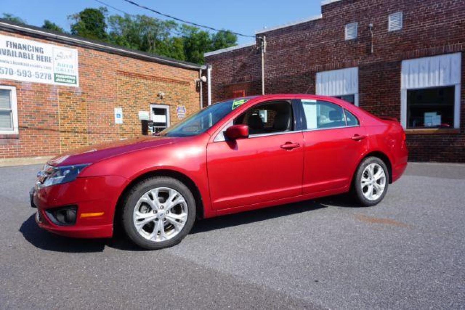 2012 Red Candy Metallic /Medium Light Stone C Ford Fusion SE (3FAHP0HA1CR) with an 2.5L L4 DOHC 16V engine, located at 312 Centre Ave, Schuylkill Haven, PA, 17972, (570) 593-5278, 40.638130, -76.177383 - Photo#0