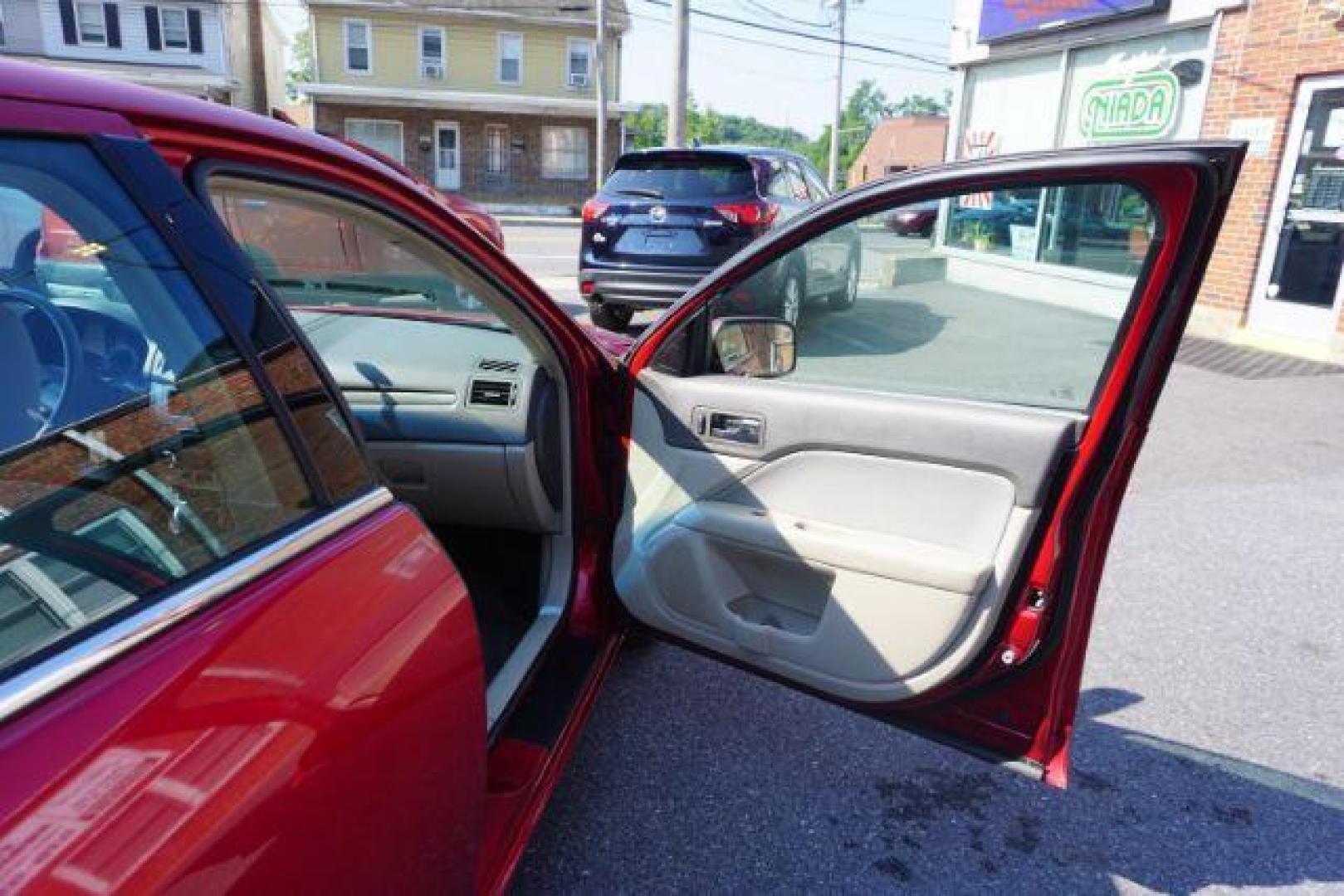 2012 Red Candy Metallic /Medium Light Stone C Ford Fusion SE (3FAHP0HA1CR) with an 2.5L L4 DOHC 16V engine, located at 312 Centre Ave, Schuylkill Haven, PA, 17972, (570) 593-5278, 40.638130, -76.177383 - Photo#45