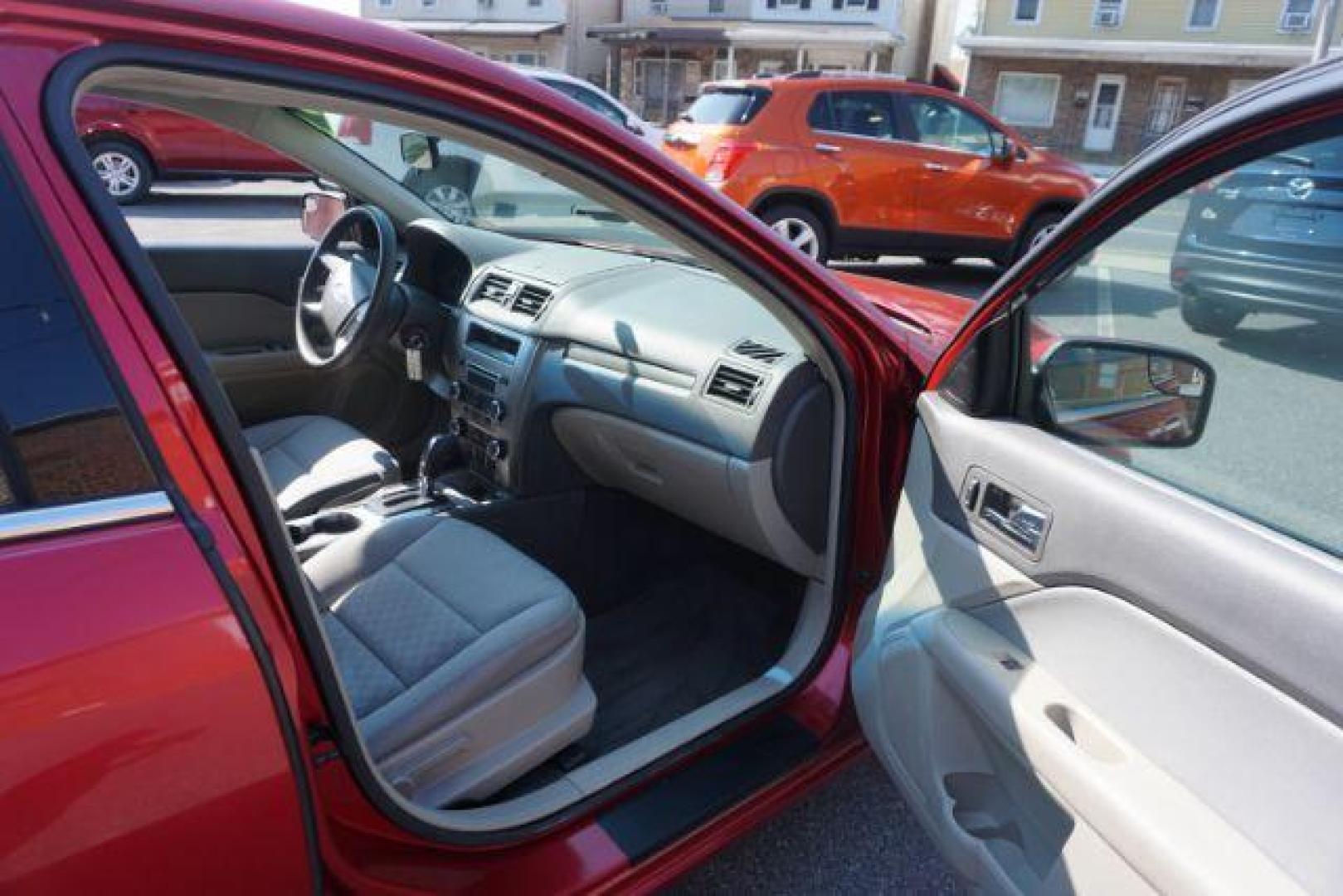 2012 Red Candy Metallic /Medium Light Stone C Ford Fusion SE (3FAHP0HA1CR) with an 2.5L L4 DOHC 16V engine, located at 312 Centre Ave, Schuylkill Haven, PA, 17972, (570) 593-5278, 40.638130, -76.177383 - Photo#47