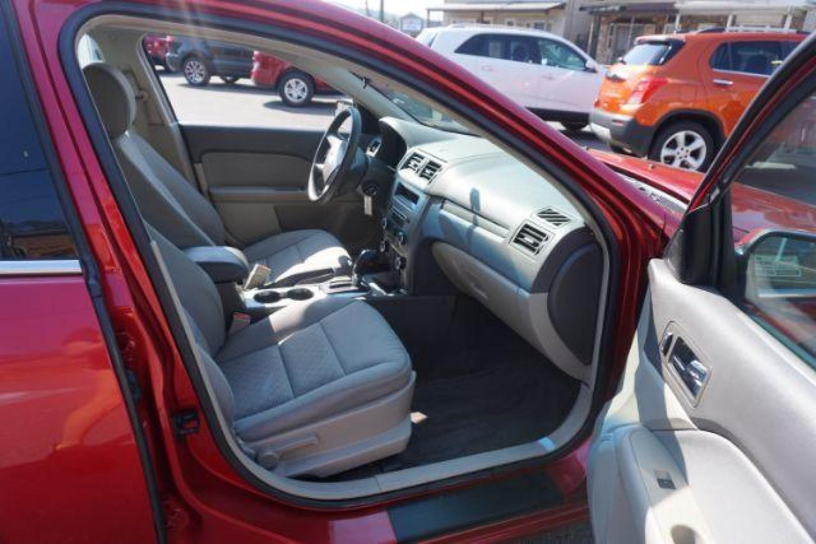 2012 Red Candy Metallic /Medium Light Stone C Ford Fusion SE (3FAHP0HA1CR) with an 2.5L L4 DOHC 16V engine, located at 312 Centre Ave, Schuylkill Haven, PA, 17972, (570) 593-5278, 40.638130, -76.177383 - Photo#48