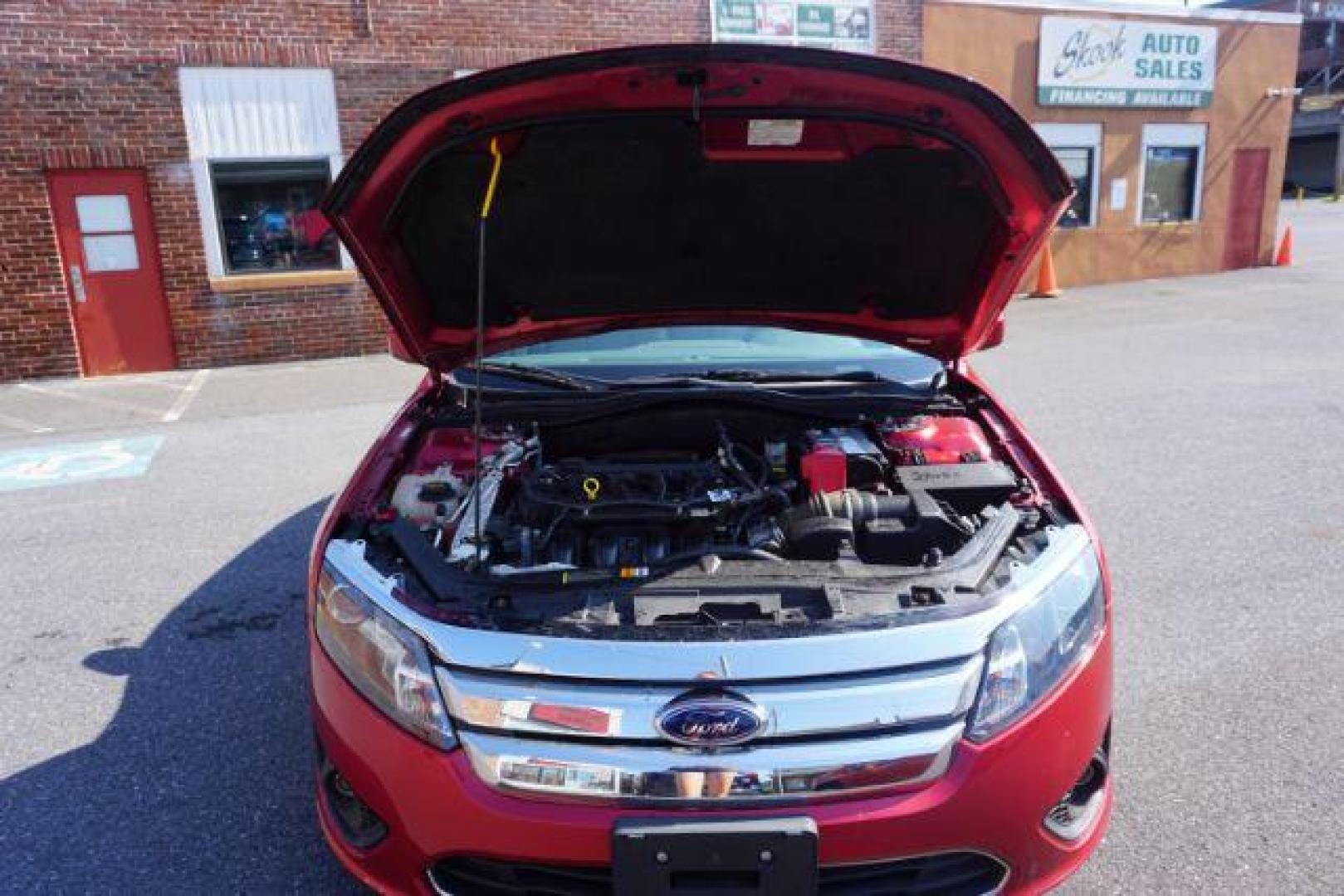 2012 Red Candy Metallic /Medium Light Stone C Ford Fusion SE (3FAHP0HA1CR) with an 2.5L L4 DOHC 16V engine, located at 312 Centre Ave, Schuylkill Haven, PA, 17972, (570) 593-5278, 40.638130, -76.177383 - Photo#52