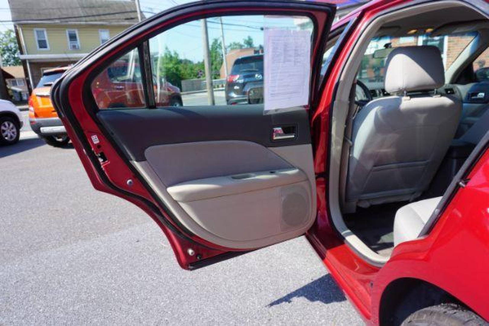 2012 Red Candy Metallic /Medium Light Stone C Ford Fusion SE (3FAHP0HA1CR) with an 2.5L L4 DOHC 16V engine, located at 312 Centre Ave, Schuylkill Haven, PA, 17972, (570) 593-5278, 40.638130, -76.177383 - Photo#29