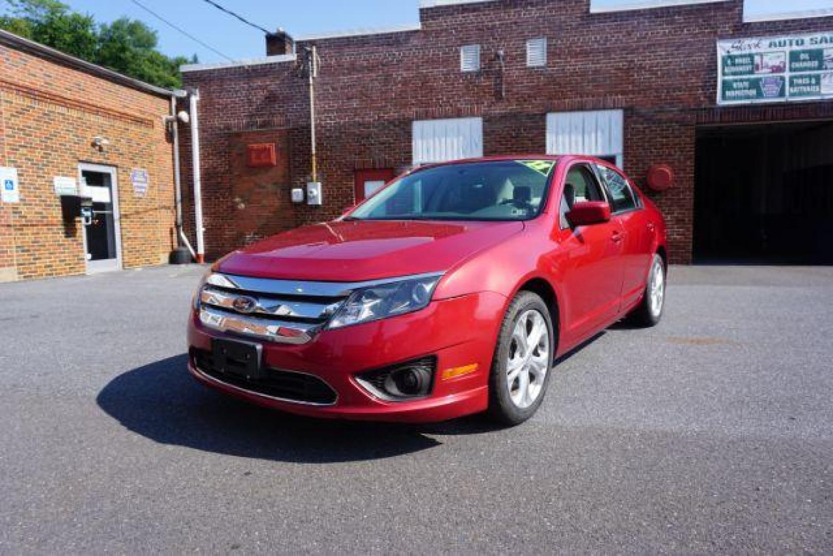 2012 Red Candy Metallic /Medium Light Stone C Ford Fusion SE (3FAHP0HA1CR) with an 2.5L L4 DOHC 16V engine, located at 312 Centre Ave, Schuylkill Haven, PA, 17972, (570) 593-5278, 40.638130, -76.177383 - Photo#1