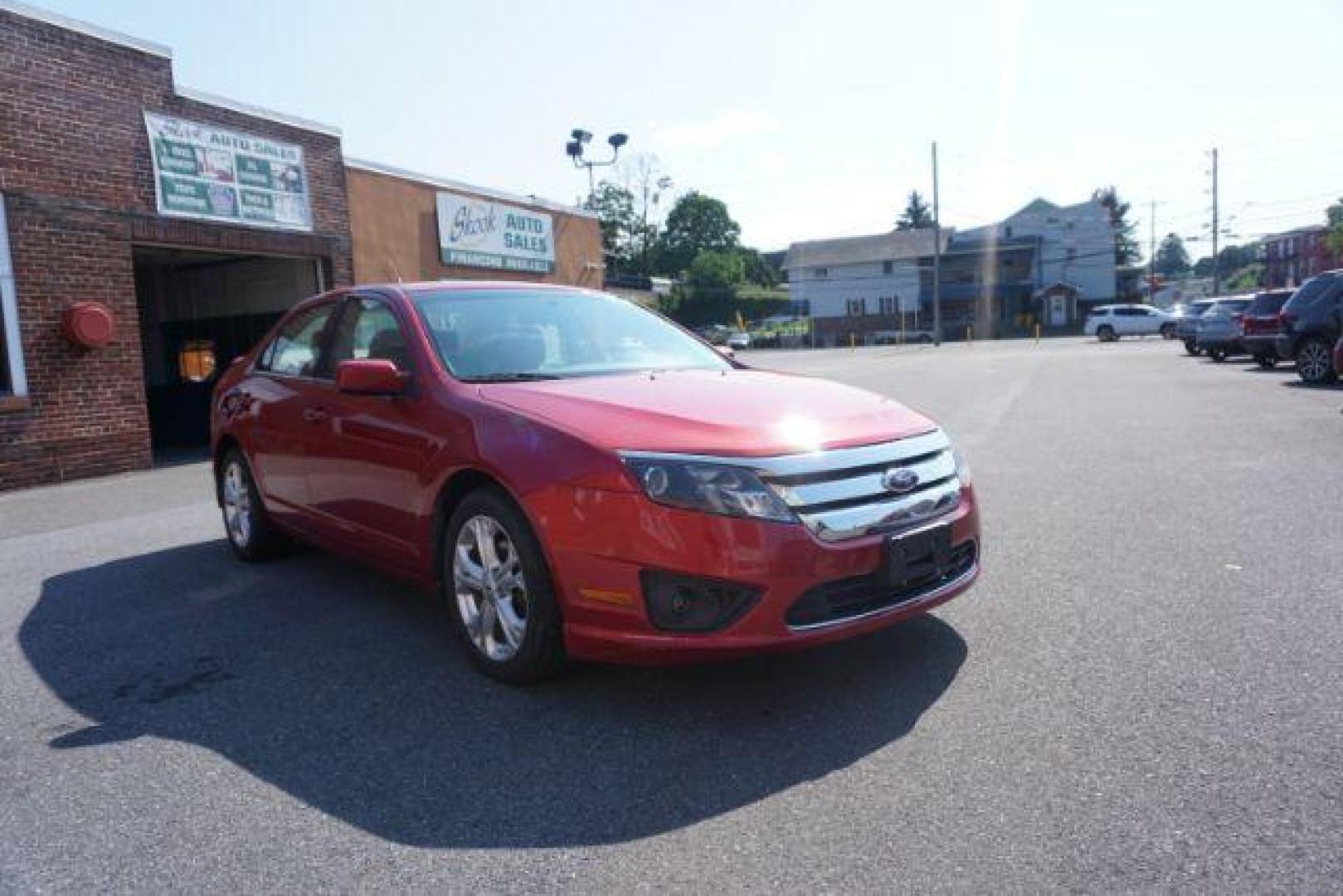 2012 Red Candy Metallic /Medium Light Stone C Ford Fusion SE (3FAHP0HA1CR) with an 2.5L L4 DOHC 16V engine, located at 312 Centre Ave, Schuylkill Haven, PA, 17972, (570) 593-5278, 40.638130, -76.177383 - Photo#4