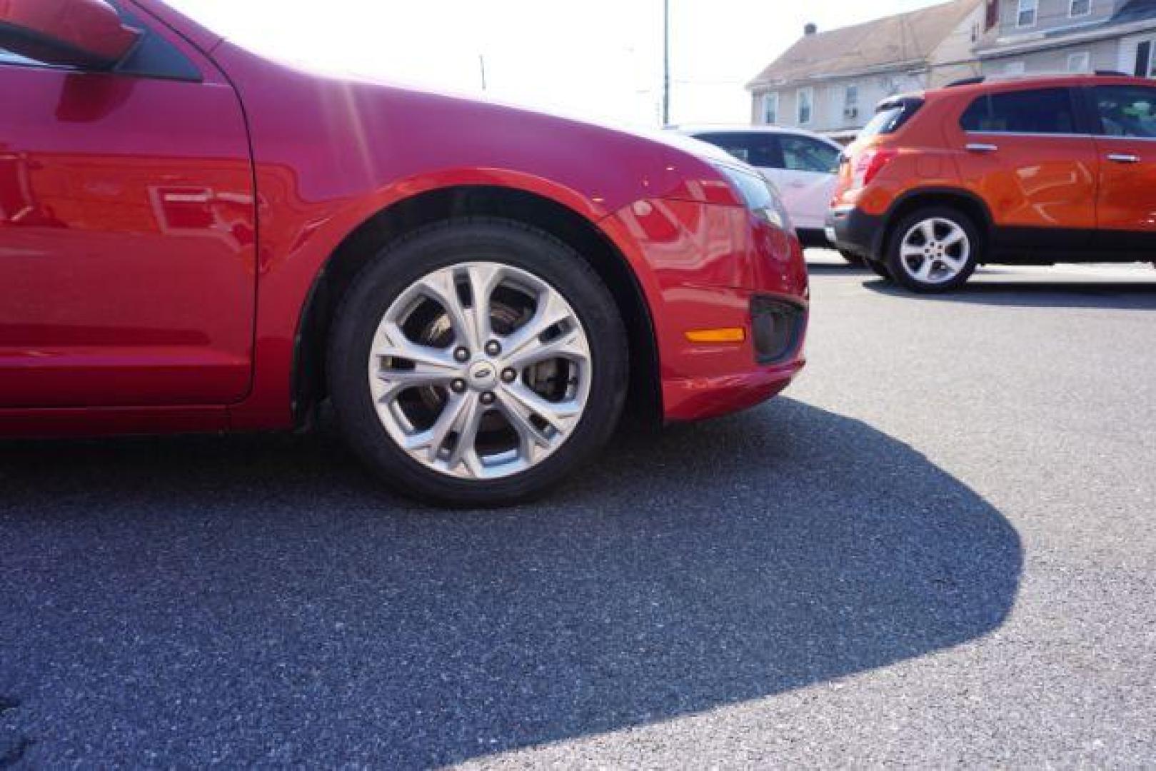 2012 Red Candy Metallic /Medium Light Stone C Ford Fusion SE (3FAHP0HA1CR) with an 2.5L L4 DOHC 16V engine, located at 312 Centre Ave, Schuylkill Haven, PA, 17972, (570) 593-5278, 40.638130, -76.177383 - Photo#5