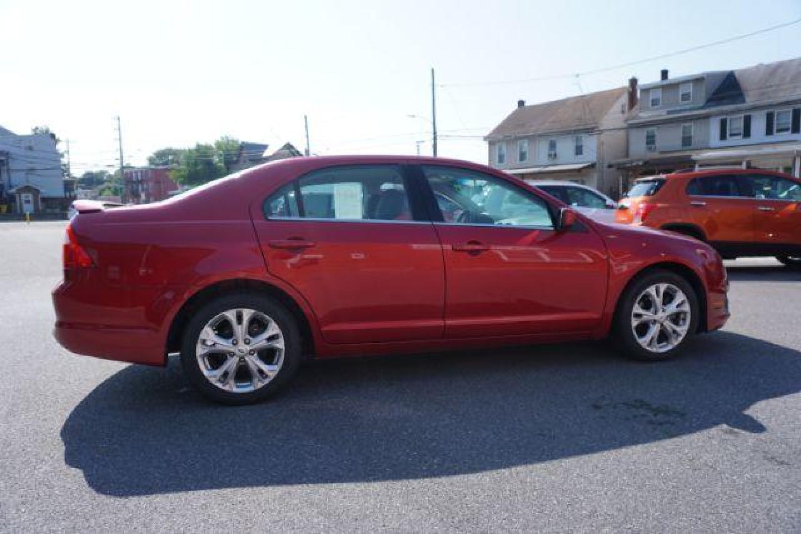 2012 Red Candy Metallic /Medium Light Stone C Ford Fusion SE (3FAHP0HA1CR) with an 2.5L L4 DOHC 16V engine, located at 312 Centre Ave, Schuylkill Haven, PA, 17972, (570) 593-5278, 40.638130, -76.177383 - Photo#7