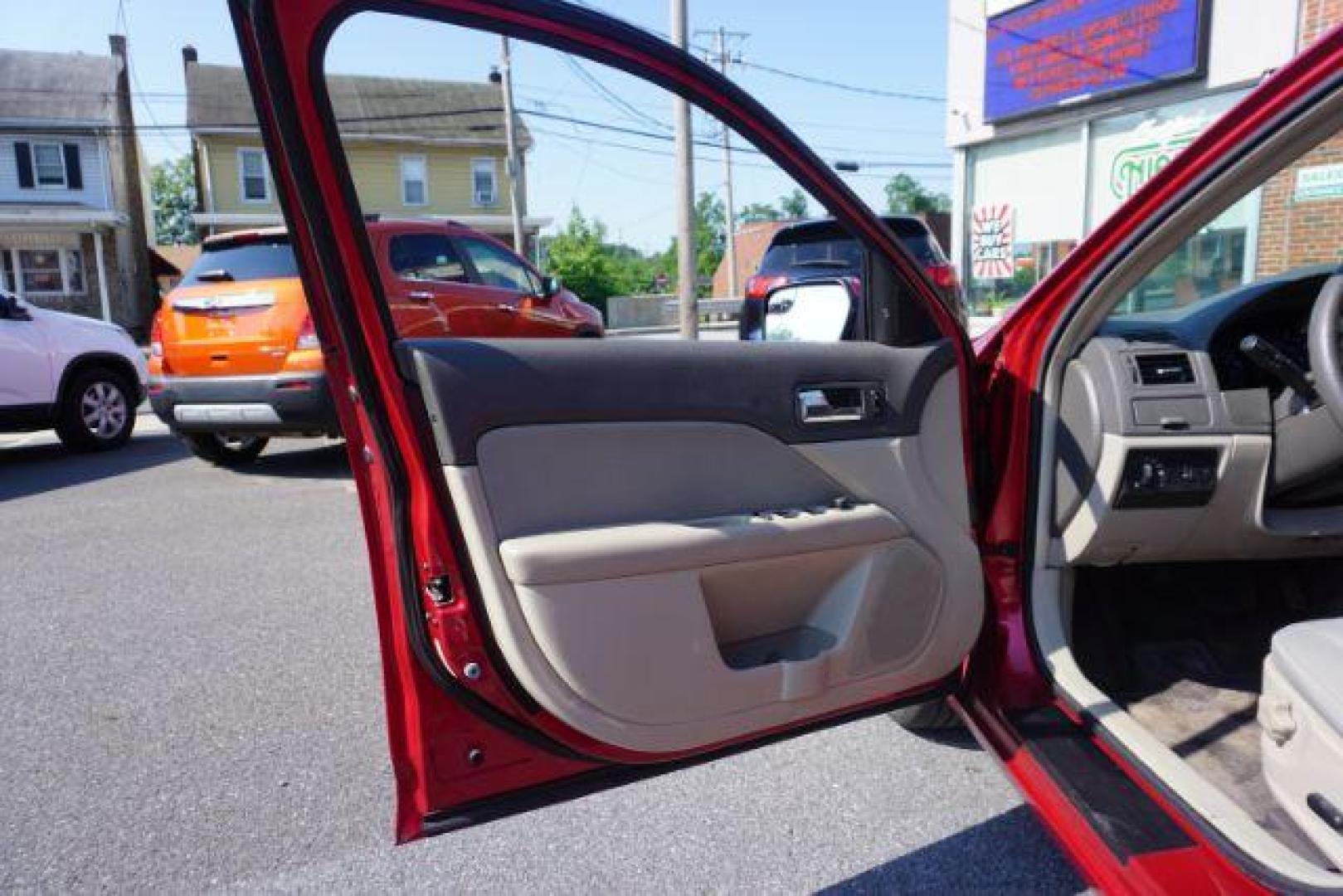 2012 Red Candy Metallic /Medium Light Stone C Ford Fusion SE (3FAHP0HA1CR) with an 2.5L L4 DOHC 16V engine, located at 312 Centre Ave, Schuylkill Haven, PA, 17972, (570) 593-5278, 40.638130, -76.177383 - Photo#16