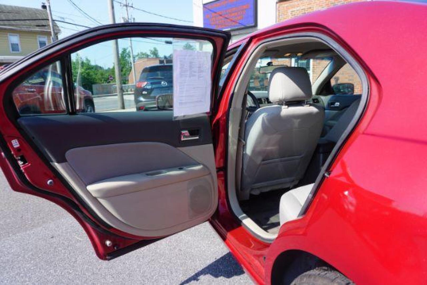 2012 Red Candy Metallic /Medium Light Stone C Ford Fusion SE (3FAHP0HA1CR) with an 2.5L L4 DOHC 16V engine, located at 312 Centre Ave, Schuylkill Haven, PA, 17972, (570) 593-5278, 40.638130, -76.177383 - Photo#28