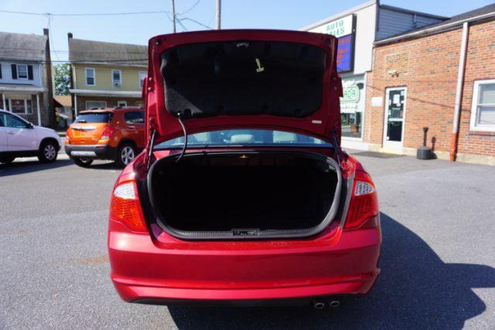 2012 Red Candy Metallic /Medium Light Stone C Ford Fusion SE (3FAHP0HA1CR) with an 2.5L L4 DOHC 16V engine, located at 312 Centre Ave, Schuylkill Haven, PA, 17972, (570) 593-5278, 40.638130, -76.177383 - Photo#38