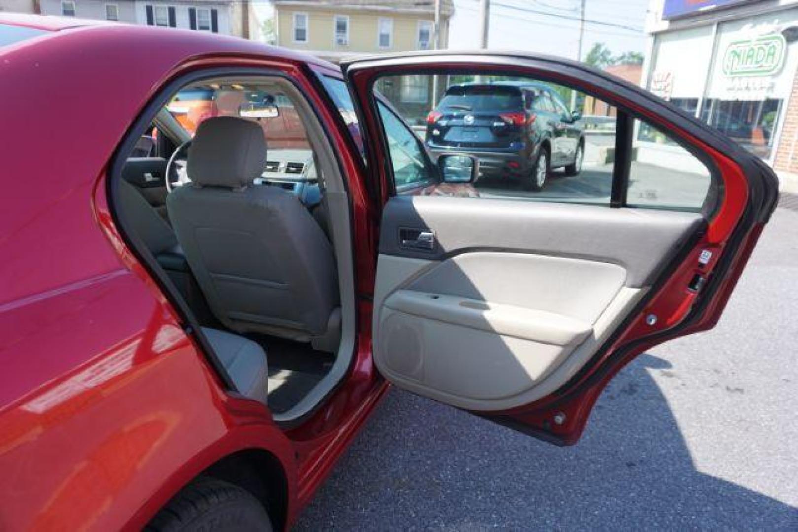 2012 Red Candy Metallic /Medium Light Stone C Ford Fusion SE (3FAHP0HA1CR) with an 2.5L L4 DOHC 16V engine, located at 312 Centre Ave, Schuylkill Haven, PA, 17972, (570) 593-5278, 40.638130, -76.177383 - Photo#39