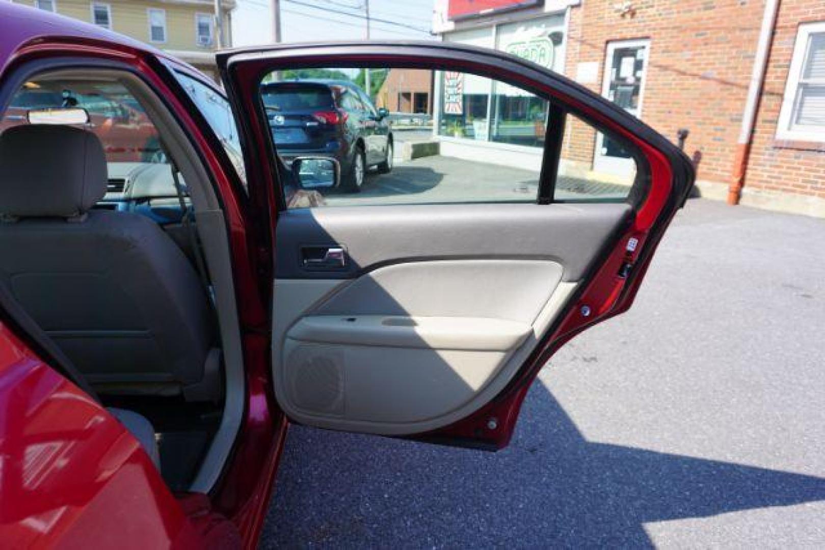 2012 Red Candy Metallic /Medium Light Stone C Ford Fusion SE (3FAHP0HA1CR) with an 2.5L L4 DOHC 16V engine, located at 312 Centre Ave, Schuylkill Haven, PA, 17972, (570) 593-5278, 40.638130, -76.177383 - Photo#40