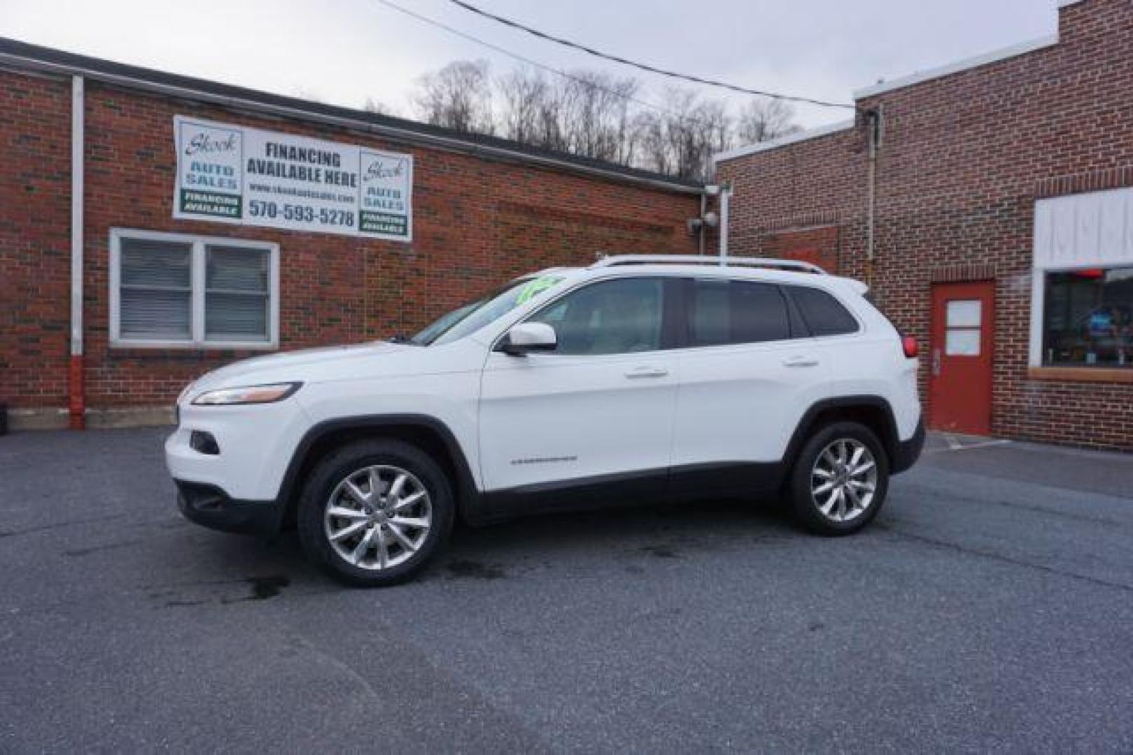 2015 Bright White Clearcoat /Light Frost Beige/Black Jeep Cherokee Limited 4WD (1C4PJMDS9FW) with an 3.2L V6 DOHC 24V engine, 9-Speed Automatic transmission, located at 312 Centre Ave, Schuylkill Haven, PA, 17972, (570) 593-5278, 40.638130, -76.177383 - automatic climate control, back up camera, blind spot monitor, lane departure warning, navigation system, passive keyless entry, rear parking sensors, univ garage door opener, aluminum/alloy wheels, heated exterior mirrors, leather seats, power driver's seat, power sunroof, remote engine starter, st - Photo#0