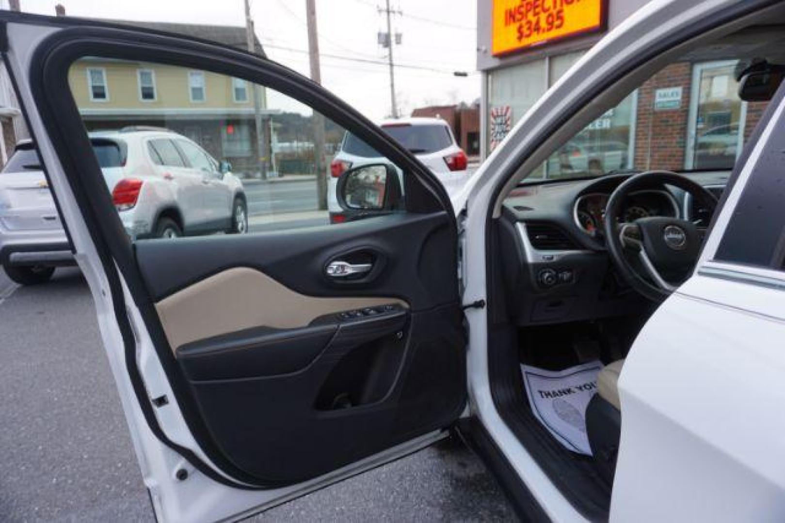 2015 Bright White Clearcoat /Light Frost Beige/Black Jeep Cherokee Limited 4WD (1C4PJMDS9FW) with an 3.2L V6 DOHC 24V engine, 9-Speed Automatic transmission, located at 312 Centre Ave, Schuylkill Haven, PA, 17972, (570) 593-5278, 40.638130, -76.177383 - automatic climate control, back up camera, blind spot monitor, lane departure warning, navigation system, passive keyless entry, rear parking sensors, univ garage door opener, aluminum/alloy wheels, heated exterior mirrors, leather seats, power driver's seat, power sunroof, remote engine starter, st - Photo#13