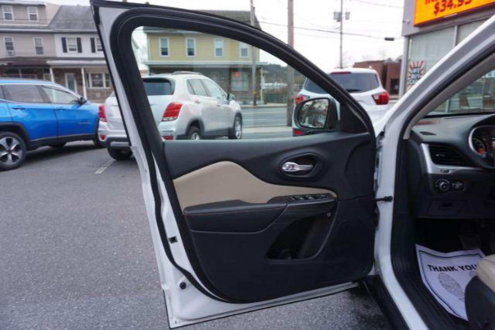 2015 Bright White Clearcoat /Light Frost Beige/Black Jeep Cherokee Limited 4WD (1C4PJMDS9FW) with an 3.2L V6 DOHC 24V engine, 9-Speed Automatic transmission, located at 312 Centre Ave, Schuylkill Haven, PA, 17972, (570) 593-5278, 40.638130, -76.177383 - automatic climate control, back up camera, blind spot monitor, lane departure warning, navigation system, passive keyless entry, rear parking sensors, univ garage door opener, aluminum/alloy wheels, heated exterior mirrors, leather seats, power driver's seat, power sunroof, remote engine starter, st - Photo#14