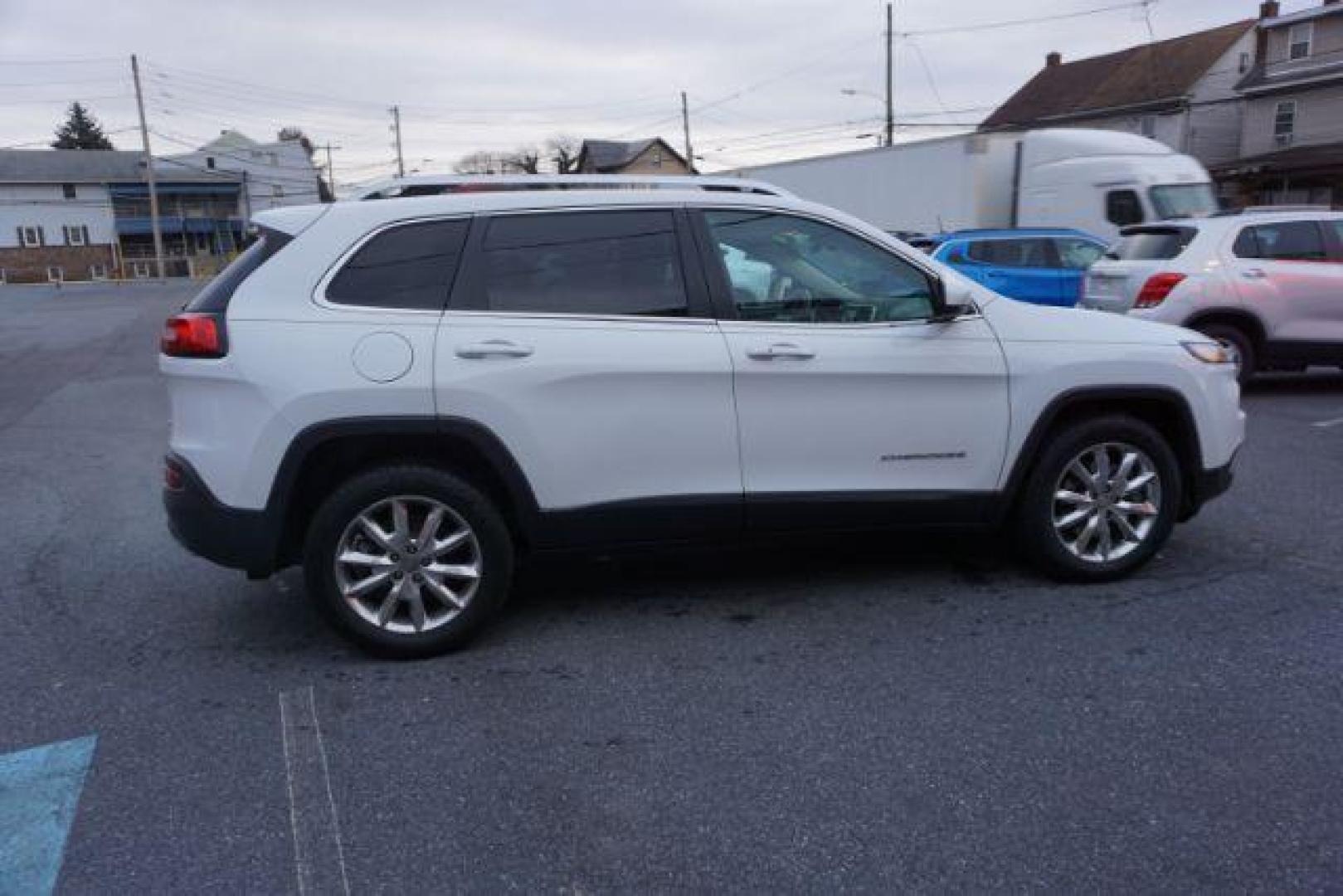 2015 Bright White Clearcoat /Light Frost Beige/Black Jeep Cherokee Limited 4WD (1C4PJMDS9FW) with an 3.2L V6 DOHC 24V engine, 9-Speed Automatic transmission, located at 312 Centre Ave, Schuylkill Haven, PA, 17972, (570) 593-5278, 40.638130, -76.177383 - automatic climate control, back up camera, blind spot monitor, lane departure warning, navigation system, passive keyless entry, rear parking sensors, univ garage door opener, aluminum/alloy wheels, heated exterior mirrors, leather seats, power driver's seat, power sunroof, remote engine starter, st - Photo#6