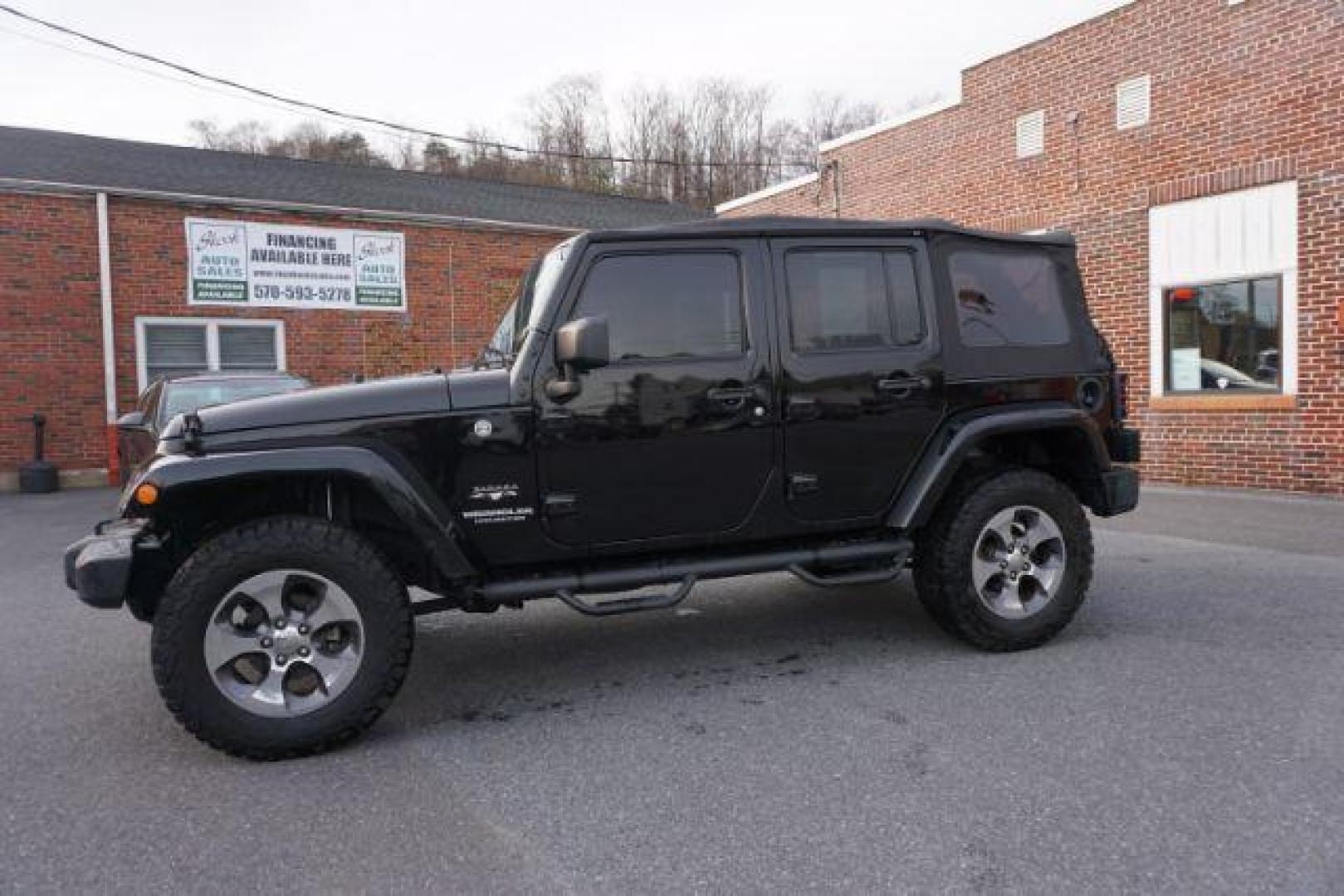 2016 Black Clear Coat /Black, leather Jeep Wrangler Unlimited Sahara 4WD (1C4BJWEG4GL) with an 3.6L V6 DOHC 24V FFV engine, 5-Speed Automatic transmission, located at 312 Centre Ave, Schuylkill Haven, PA, 17972, (570) 593-5278, 40.638130, -76.177383 - automatic climate control, bluetooth, navigation, fixed running boards, hard top, leather seats, remote engine starter, towing pkg, heated front seats, Alpine stereo system - Photo#0