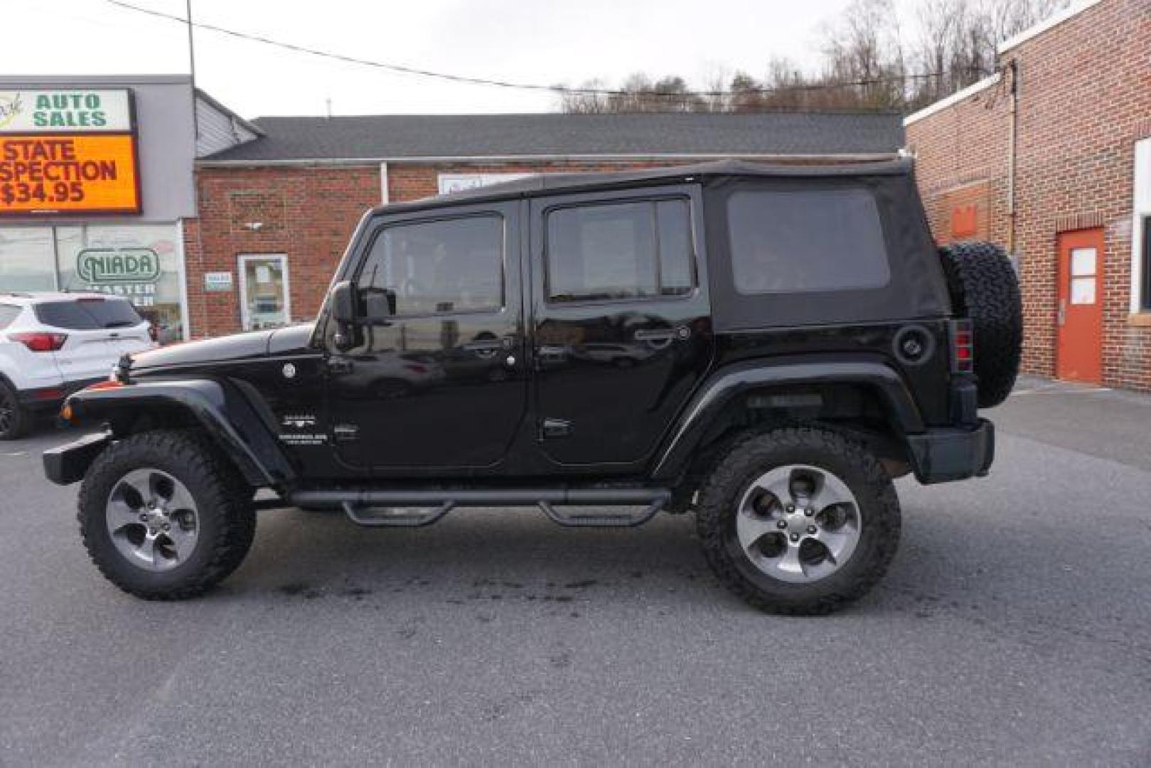 2016 Black Clear Coat /Black, leather Jeep Wrangler Unlimited Sahara 4WD (1C4BJWEG4GL) with an 3.6L V6 DOHC 24V FFV engine, 5-Speed Automatic transmission, located at 312 Centre Ave, Schuylkill Haven, PA, 17972, (570) 593-5278, 40.638130, -76.177383 - automatic climate control, bluetooth, navigation, fixed running boards, hard top, leather seats, remote engine starter, towing pkg, heated front seats, Alpine stereo system - Photo#14