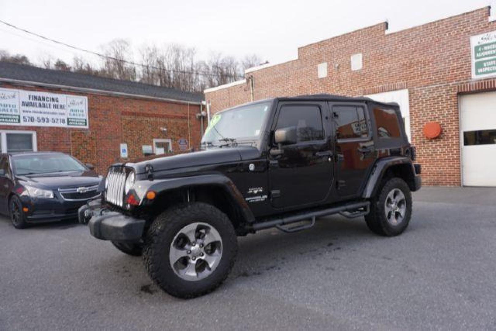 2016 Black Clear Coat /Black, leather Jeep Wrangler Unlimited Sahara 4WD (1C4BJWEG4GL) with an 3.6L V6 DOHC 24V FFV engine, 5-Speed Automatic transmission, located at 312 Centre Ave, Schuylkill Haven, PA, 17972, (570) 593-5278, 40.638130, -76.177383 - automatic climate control, bluetooth, navigation, fixed running boards, hard top, leather seats, remote engine starter, towing pkg, heated front seats, Alpine stereo system - Photo#1