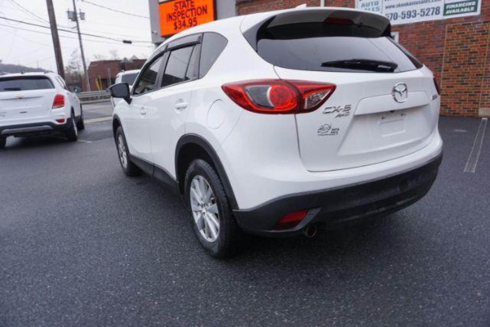 2014 Crystal White Pearl Mica /Sand Mazda CX-5 Touring AWD (JM3KE4CY4E0) with an 2.5L L4 DOHC 16V engine, 6-Speed Automatic transmission, located at 312 Centre Ave, Schuylkill Haven, PA, 17972, (570) 593-5278, 40.638130, -76.177383 - bluetooth, navigation system, fog lights - Photo#11