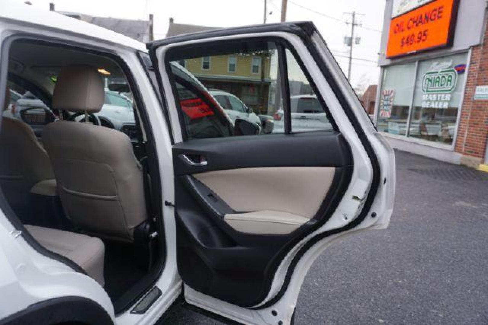 2014 Crystal White Pearl Mica /Sand Mazda CX-5 Touring AWD (JM3KE4CY4E0) with an 2.5L L4 DOHC 16V engine, 6-Speed Automatic transmission, located at 312 Centre Ave, Schuylkill Haven, PA, 17972, (570) 593-5278, 40.638130, -76.177383 - bluetooth, navigation system, fog lights - Photo#39