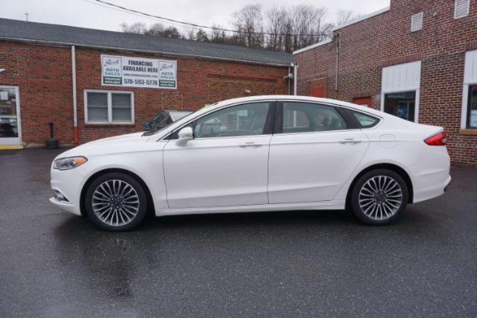 2017 White Platinum Metallic Tri-Coat /Ebony, leather Ford Fusion SE AWD (3FA6P0T90HR) with an 2.0L L4 DOHC 16V engine, 6-Speed Automatic transmission, located at 312 Centre Ave, Schuylkill Haven, PA, 17972, (570) 593-5278, 40.638130, -76.177383 - adaptive cruise control, automatic climate control, blind spot monitor, collision avoidance, drivers seat memory, fog lights, heated exterior mirrors, heated front seats, lane departure warning, leather seats, navigation system, passive keyless entry, rear parking sensors, remote engine starter - Photo#0