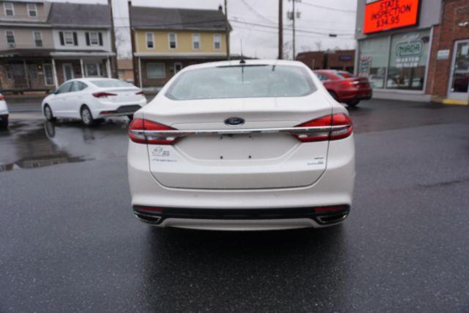 2017 White Platinum Metallic Tri-Coat /Ebony, leather Ford Fusion SE AWD (3FA6P0T90HR) with an 2.0L L4 DOHC 16V engine, 6-Speed Automatic transmission, located at 312 Centre Ave, Schuylkill Haven, PA, 17972, (570) 593-5278, 40.638130, -76.177383 - adaptive cruise control, automatic climate control, blind spot monitor, collision avoidance, drivers seat memory, fog lights, heated exterior mirrors, heated front seats, lane departure warning, leather seats, navigation system, passive keyless entry, rear parking sensors, remote engine starter - Photo#14