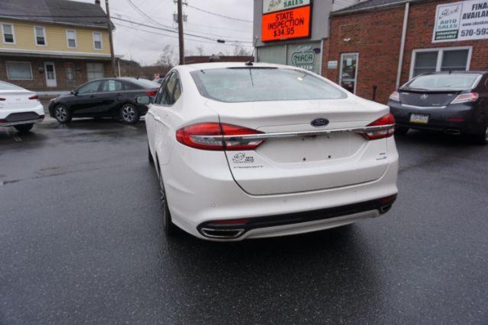 2017 White Platinum Metallic Tri-Coat /Ebony, leather Ford Fusion SE AWD (3FA6P0T90HR) with an 2.0L L4 DOHC 16V engine, 6-Speed Automatic transmission, located at 312 Centre Ave, Schuylkill Haven, PA, 17972, (570) 593-5278, 40.638130, -76.177383 - adaptive cruise control, automatic climate control, blind spot monitor, collision avoidance, drivers seat memory, fog lights, heated exterior mirrors, heated front seats, lane departure warning, leather seats, navigation system, passive keyless entry, rear parking sensors, remote engine starter - Photo#15