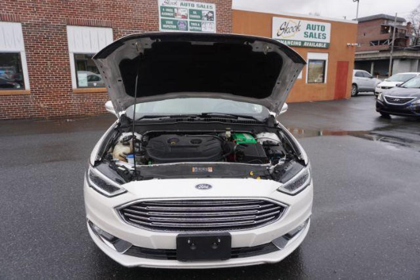 2017 White Platinum Metallic Tri-Coat /Ebony, leather Ford Fusion SE AWD (3FA6P0T90HR) with an 2.0L L4 DOHC 16V engine, 6-Speed Automatic transmission, located at 312 Centre Ave, Schuylkill Haven, PA, 17972, (570) 593-5278, 40.638130, -76.177383 - adaptive cruise control, automatic climate control, blind spot monitor, collision avoidance, drivers seat memory, fog lights, heated exterior mirrors, heated front seats, lane departure warning, leather seats, navigation system, passive keyless entry, rear parking sensors, remote engine starter - Photo#53