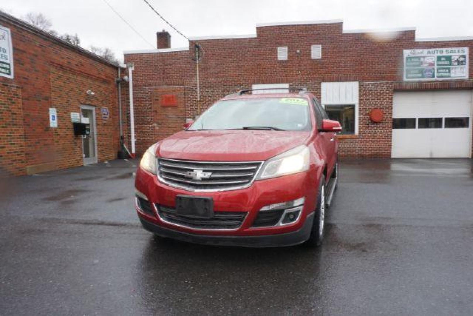 2014 Crystal Red Tintcoat /Dk Titanium/Light Titanium Chevrolet Traverse 1LT FWD (1GNKRGKD4EJ) with an 3.6L V6 DOHC 24V engine, 6-Speed Automatic transmission, located at 312 Centre Ave, Schuylkill Haven, PA, 17972, (570) 593-5278, 40.638130, -76.177383 - automatic climate control, heated front seats, power driver's seat, power sunroof, universal garage door opener - Photo#3