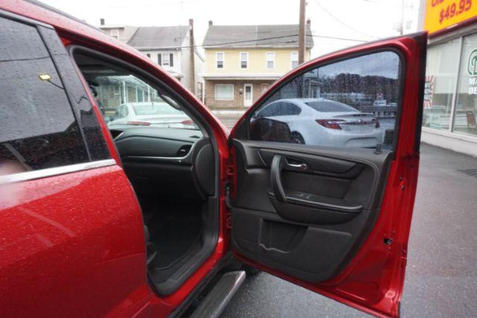 2014 Crystal Red Tintcoat /Dk Titanium/Light Titanium Chevrolet Traverse 1LT FWD (1GNKRGKD4EJ) with an 3.6L V6 DOHC 24V engine, 6-Speed Automatic transmission, located at 312 Centre Ave, Schuylkill Haven, PA, 17972, (570) 593-5278, 40.638130, -76.177383 - automatic climate control, heated front seats, power driver's seat, power sunroof, universal garage door opener - Photo#52