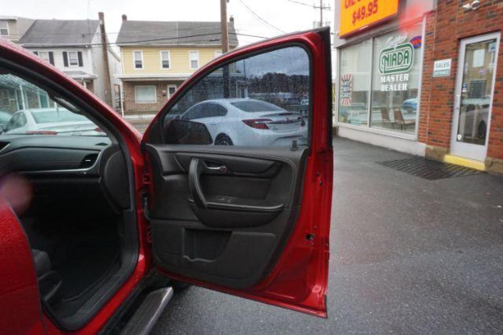 2014 Crystal Red Tintcoat /Dk Titanium/Light Titanium Chevrolet Traverse 1LT FWD (1GNKRGKD4EJ) with an 3.6L V6 DOHC 24V engine, 6-Speed Automatic transmission, located at 312 Centre Ave, Schuylkill Haven, PA, 17972, (570) 593-5278, 40.638130, -76.177383 - automatic climate control, heated front seats, power driver's seat, power sunroof, universal garage door opener - Photo#53