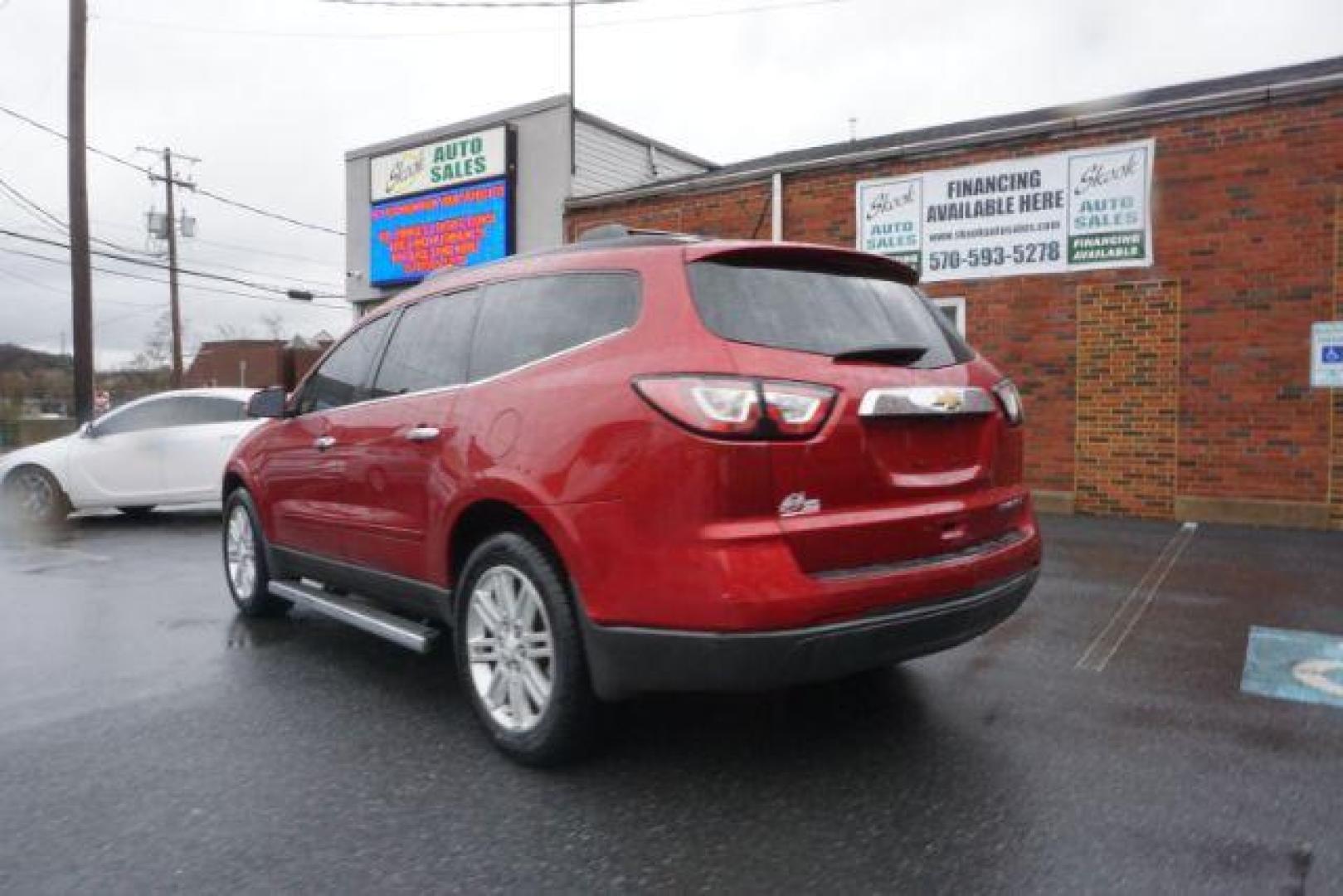 2014 Crystal Red Tintcoat /Dk Titanium/Light Titanium Chevrolet Traverse 1LT FWD (1GNKRGKD4EJ) with an 3.6L V6 DOHC 24V engine, 6-Speed Automatic transmission, located at 312 Centre Ave, Schuylkill Haven, PA, 17972, (570) 593-5278, 40.638130, -76.177383 - automatic climate control, heated front seats, power driver's seat, power sunroof, universal garage door opener - Photo#7