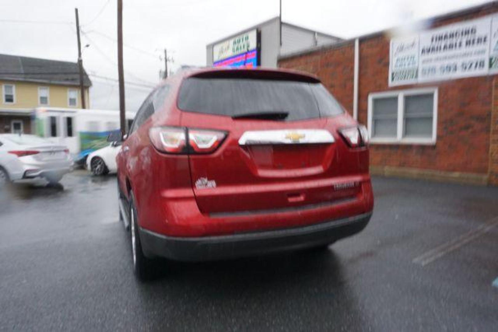 2014 Crystal Red Tintcoat /Dk Titanium/Light Titanium Chevrolet Traverse 1LT FWD (1GNKRGKD4EJ) with an 3.6L V6 DOHC 24V engine, 6-Speed Automatic transmission, located at 312 Centre Ave, Schuylkill Haven, PA, 17972, (570) 593-5278, 40.638130, -76.177383 - automatic climate control, heated front seats, power driver's seat, power sunroof, universal garage door opener - Photo#8