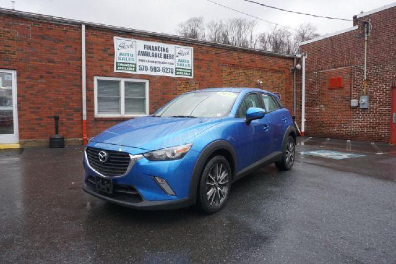 2017 Dynamic Blue Mica /Black Mazda CX-3 Touring AWD (JM1DKFC77H0) with an 2.0L L4 DOHC 16V engine, 6-Speed Automatic transmission, located at 312 Centre Ave, Schuylkill Haven, PA, 17972, (570) 593-5278, 40.638130, -76.177383 - Bose premium sound, Navigation, Rear Parking Sensors - Photo#1