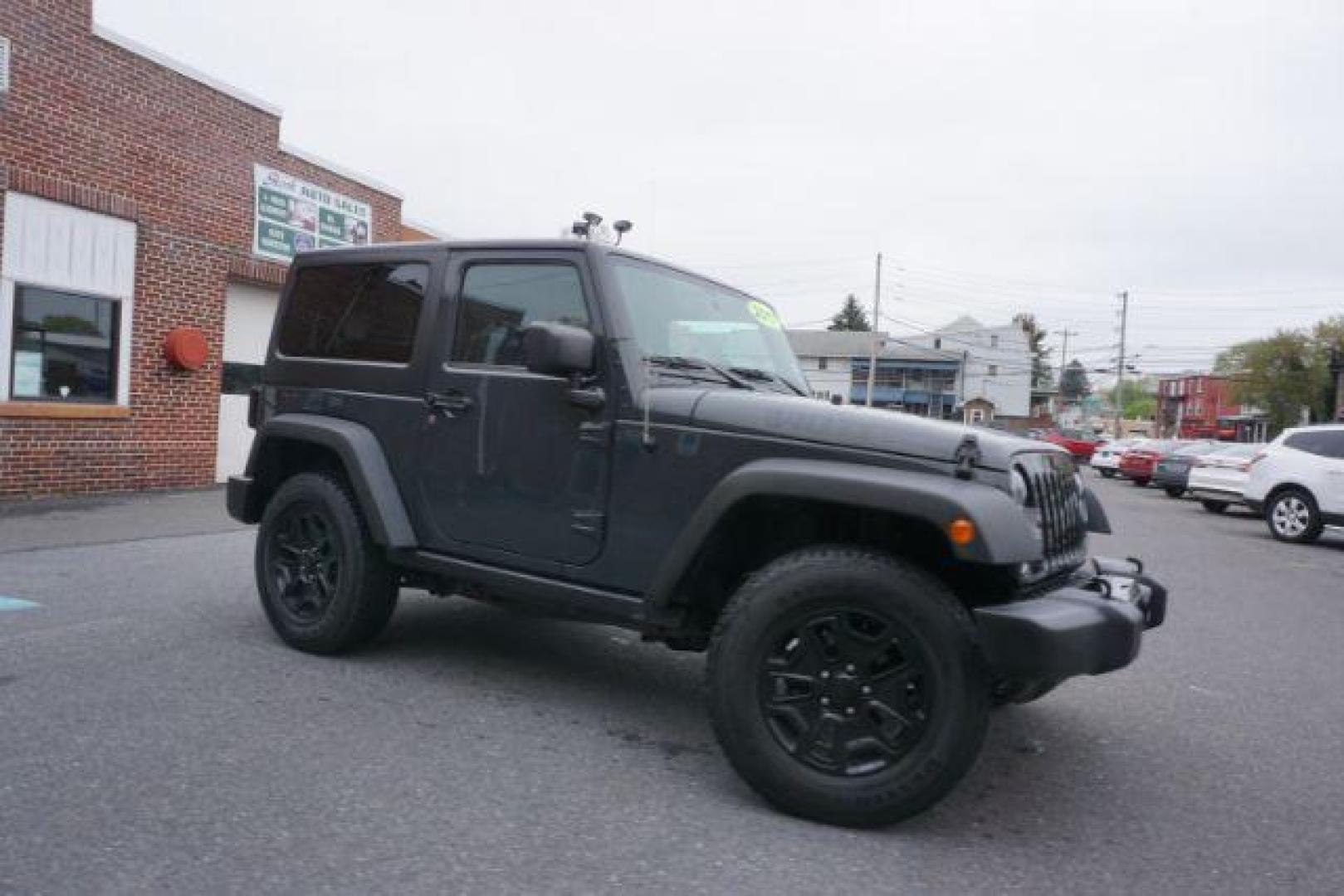 2017 Black Clear Coat Jeep Wrangler Sport 4WD (1C4AJWAG1HL) with an 3.6L V6 DOHC 24V FFV engine, 5-Speed Automatic transmission, located at 312 Centre Ave, Schuylkill Haven, PA, 17972, (570) 593-5278, 40.638130, -76.177383 - hard top, locking/limited slip differential, towing package - Photo#17