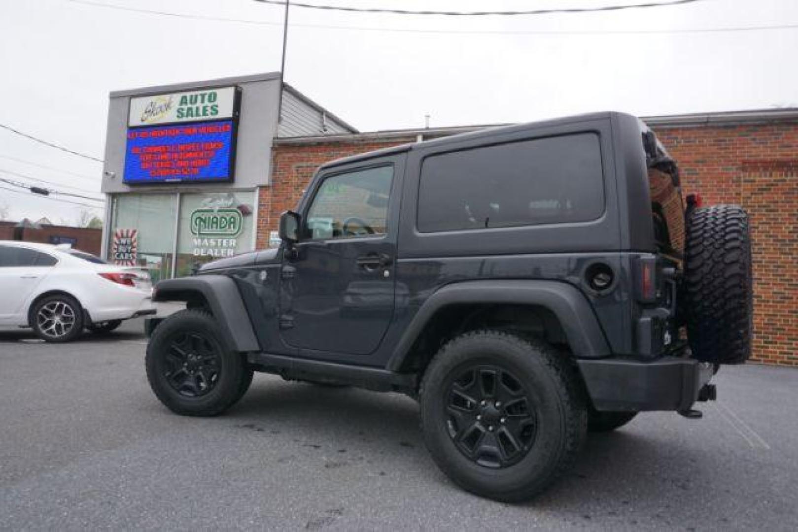 2017 Black Clear Coat Jeep Wrangler Sport 4WD (1C4AJWAG1HL) with an 3.6L V6 DOHC 24V FFV engine, 5-Speed Automatic transmission, located at 312 Centre Ave, Schuylkill Haven, PA, 17972, (570) 593-5278, 40.638130, -76.177383 - hard top, locking/limited slip differential, towing package - Photo#7