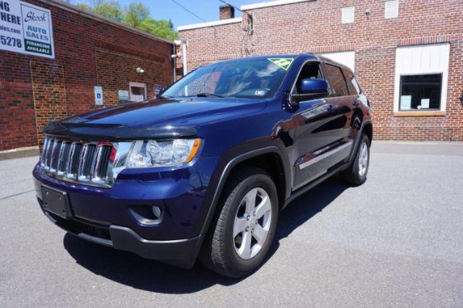 2013 True Blue Pearl Jeep Grand Cherokee Laredo 4WD (1C4RJFAG7DC) with an 3.6L V6 DOHC 24V engine, 5-Speed Automatic transmission, located at 312 Centre Ave, Schuylkill Haven, PA, 17972, (570) 593-5278, 40.638130, -76.177383 - automatic climate control, back up camera, heated front seats, leather seats, navigation, power sunroof, rear parking sensors, towing pkg - Photo#1