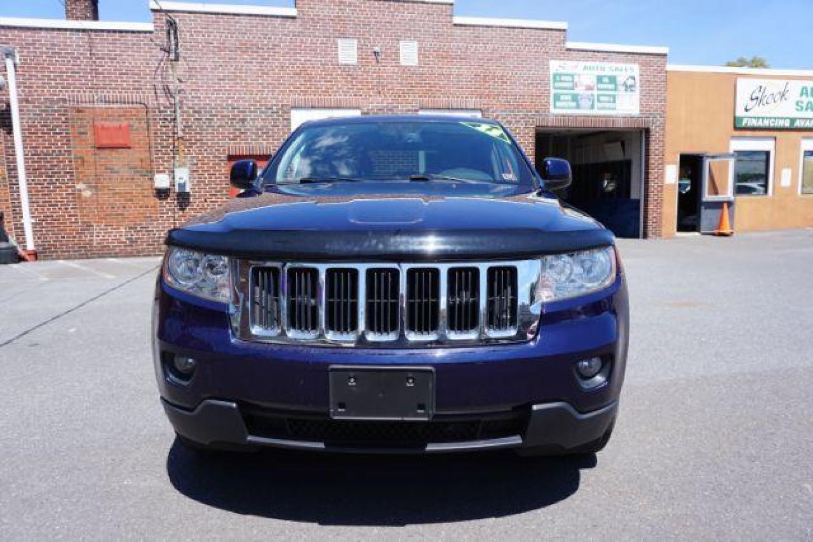 2013 True Blue Pearl Jeep Grand Cherokee Laredo 4WD (1C4RJFAG7DC) with an 3.6L V6 DOHC 24V engine, 5-Speed Automatic transmission, located at 312 Centre Ave, Schuylkill Haven, PA, 17972, (570) 593-5278, 40.638130, -76.177383 - automatic climate control, back up camera, heated front seats, leather seats, navigation, power sunroof, rear parking sensors, towing pkg - Photo#3