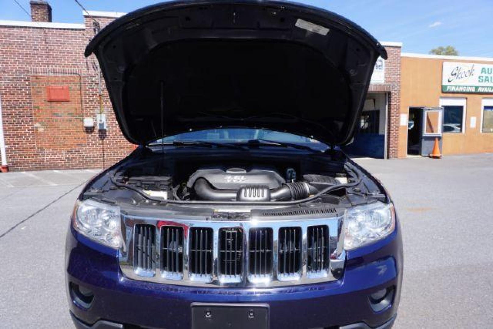 2013 True Blue Pearl Jeep Grand Cherokee Laredo 4WD (1C4RJFAG7DC) with an 3.6L V6 DOHC 24V engine, 5-Speed Automatic transmission, located at 312 Centre Ave, Schuylkill Haven, PA, 17972, (570) 593-5278, 40.638130, -76.177383 - automatic climate control, back up camera, heated front seats, leather seats, navigation, power sunroof, rear parking sensors, towing pkg - Photo#54