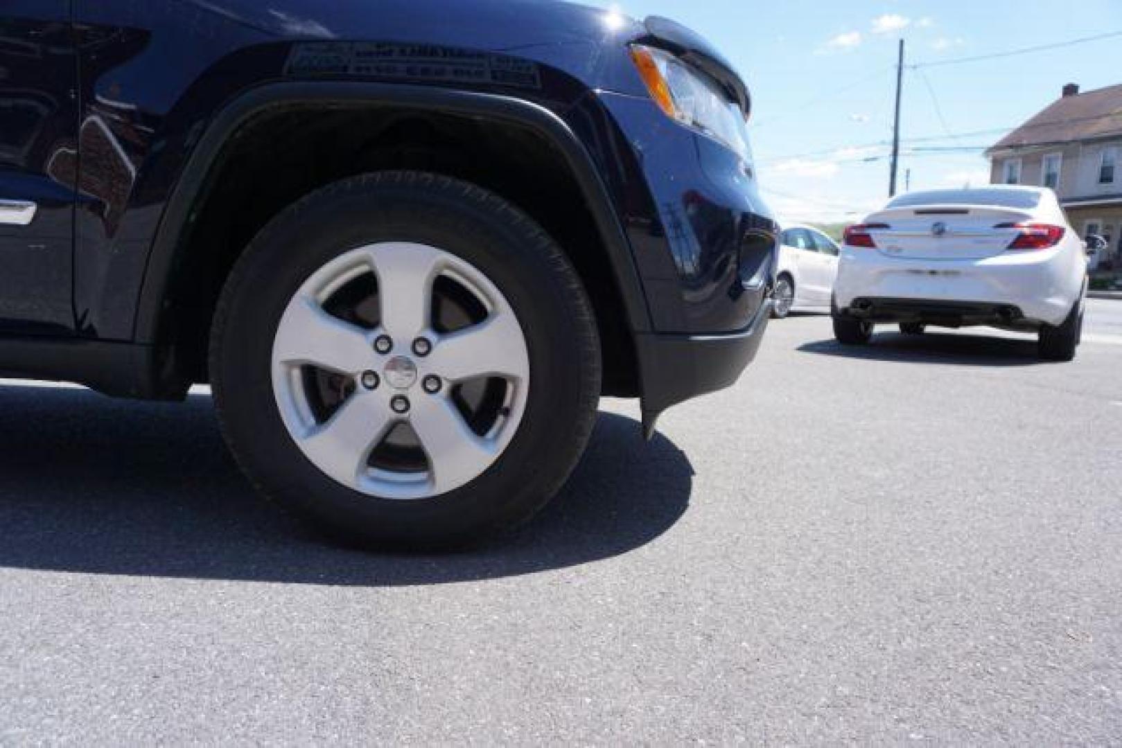 2013 True Blue Pearl Jeep Grand Cherokee Laredo 4WD (1C4RJFAG7DC) with an 3.6L V6 DOHC 24V engine, 5-Speed Automatic transmission, located at 312 Centre Ave, Schuylkill Haven, PA, 17972, (570) 593-5278, 40.638130, -76.177383 - automatic climate control, back up camera, heated front seats, leather seats, navigation, power sunroof, rear parking sensors, towing pkg - Photo#5