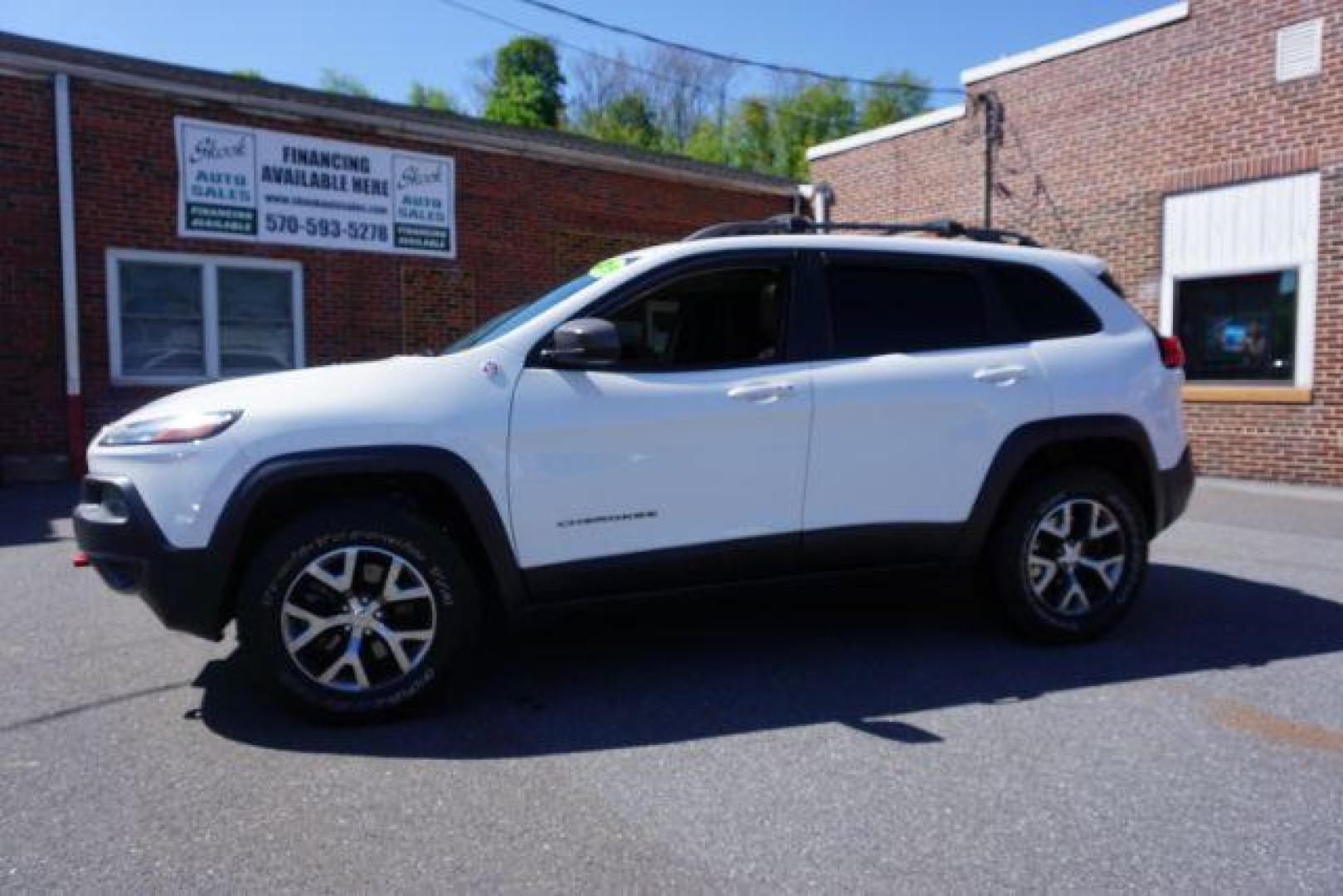 2015 Bright White Clearcoat Jeep Cherokee Trailhawk 4WD (1C4PJMBS2FW) with an 3.2L V6 DOHC 24V engine, 9-Speed Automatic transmission, located at 312 Centre Ave, Schuylkill Haven, PA, 17972, (570) 593-5278, 40.638130, -76.177383 - driver's seat memory, heated front seats, lane departure warning, leather seats, navigation, passive keyless entry, power drivers seat, power liftgate, power sunroof, rear parking sensors, towing pkg - Photo#0