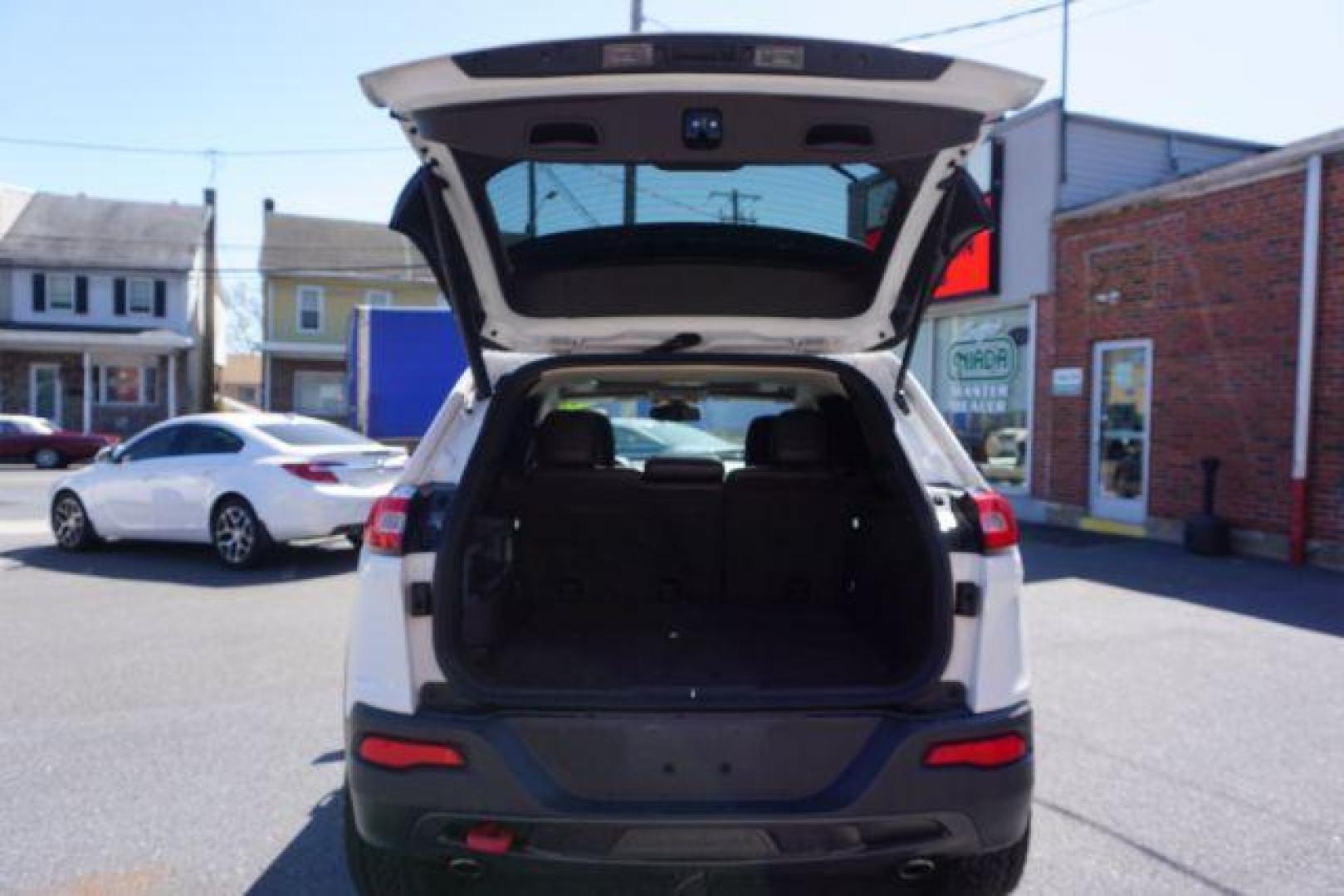 2015 Bright White Clearcoat Jeep Cherokee Trailhawk 4WD (1C4PJMBS2FW) with an 3.2L V6 DOHC 24V engine, 9-Speed Automatic transmission, located at 312 Centre Ave, Schuylkill Haven, PA, 17972, (570) 593-5278, 40.638130, -76.177383 - driver's seat memory, heated front seats, lane departure warning, leather seats, navigation, passive keyless entry, power drivers seat, power liftgate, power sunroof, rear parking sensors, towing pkg - Photo#41