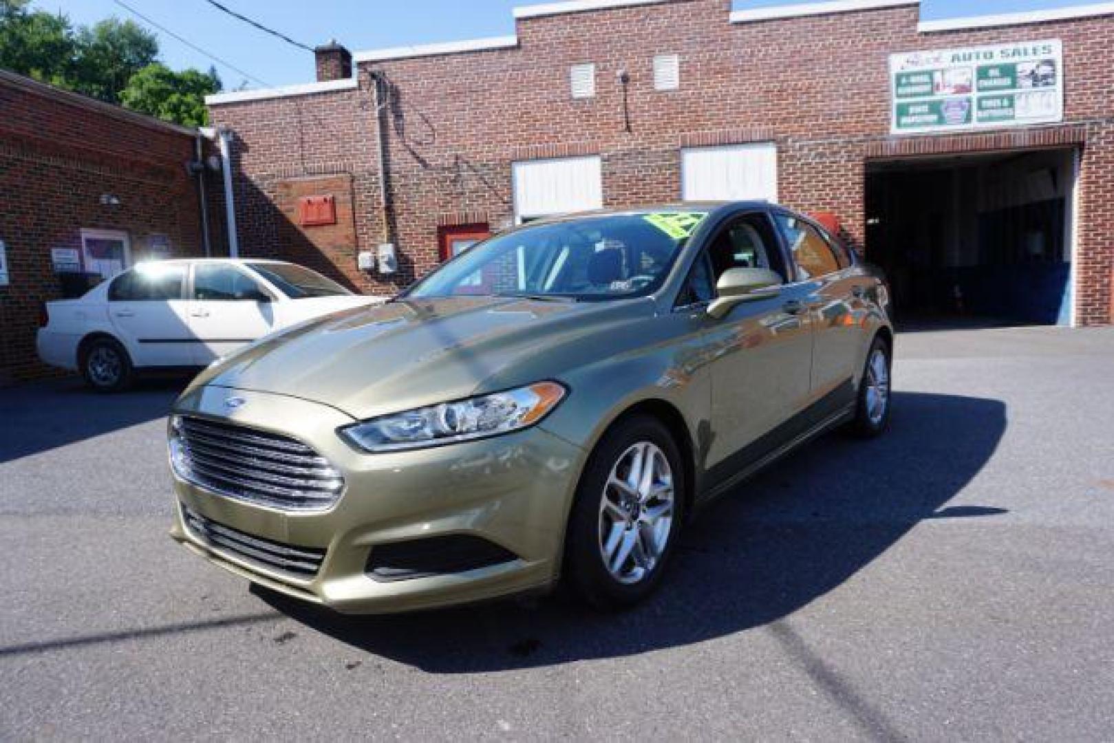 2013 Ginger Ale /Charcoal Black Ford Fusion SE (3FA6P0H76DR) with an 2.5L L4 DOHC 16V engine, located at 312 Centre Ave, Schuylkill Haven, PA, 17972, (570) 593-5278, 40.638130, -76.177383 - Photo#2