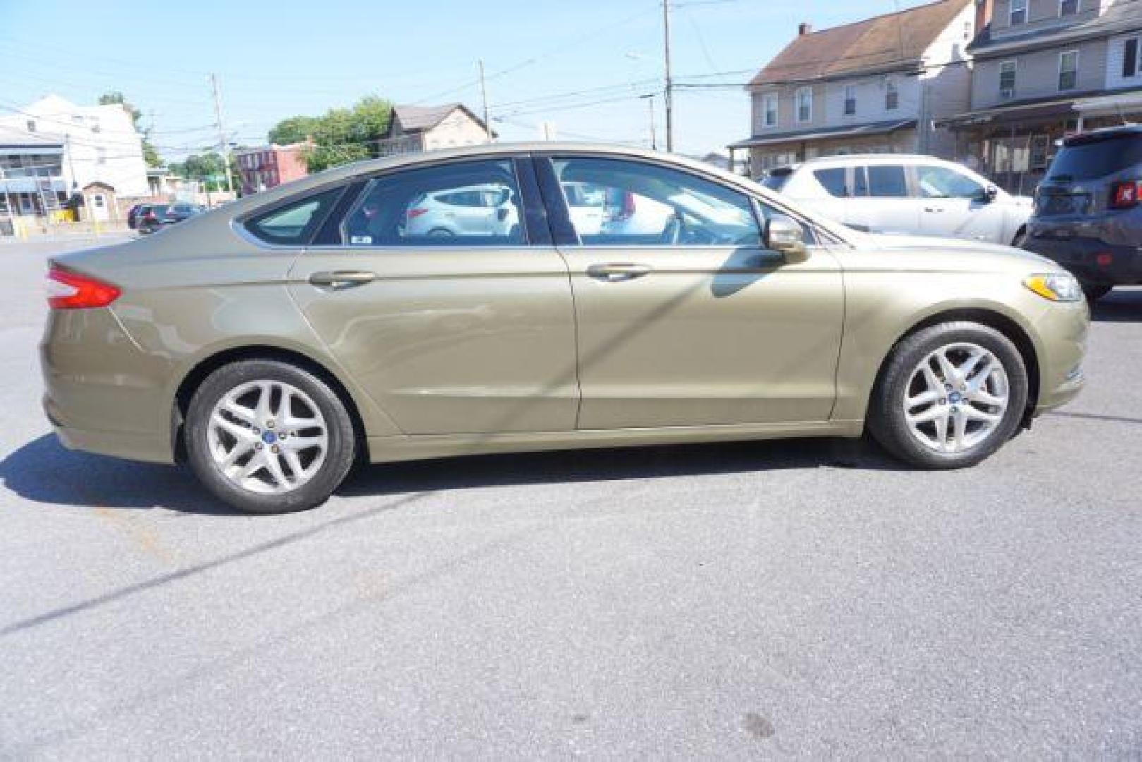 2013 Ginger Ale /Charcoal Black Ford Fusion SE (3FA6P0H76DR) with an 2.5L L4 DOHC 16V engine, located at 312 Centre Ave, Schuylkill Haven, PA, 17972, (570) 593-5278, 40.638130, -76.177383 - Photo#8