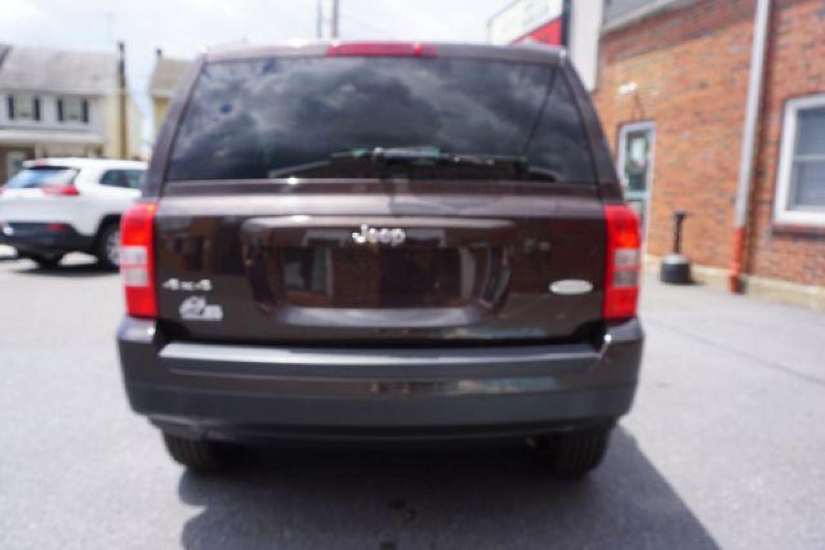 2014 Rugged Brown Pearlcoat /Light Pebble Beige/Dk Slate Jeep Patriot Latitude 4WD (1C4NJRFB3ED) with an 2.4L L4 DOHC 16V engine, Continuously Variable Transmission transmission, located at 312 Centre Ave, Schuylkill Haven, PA, 17972, (570) 593-5278, 40.638130, -76.177383 - Boston Accoustics stereo, locking/limited slip differential, power sunroof - Photo#12