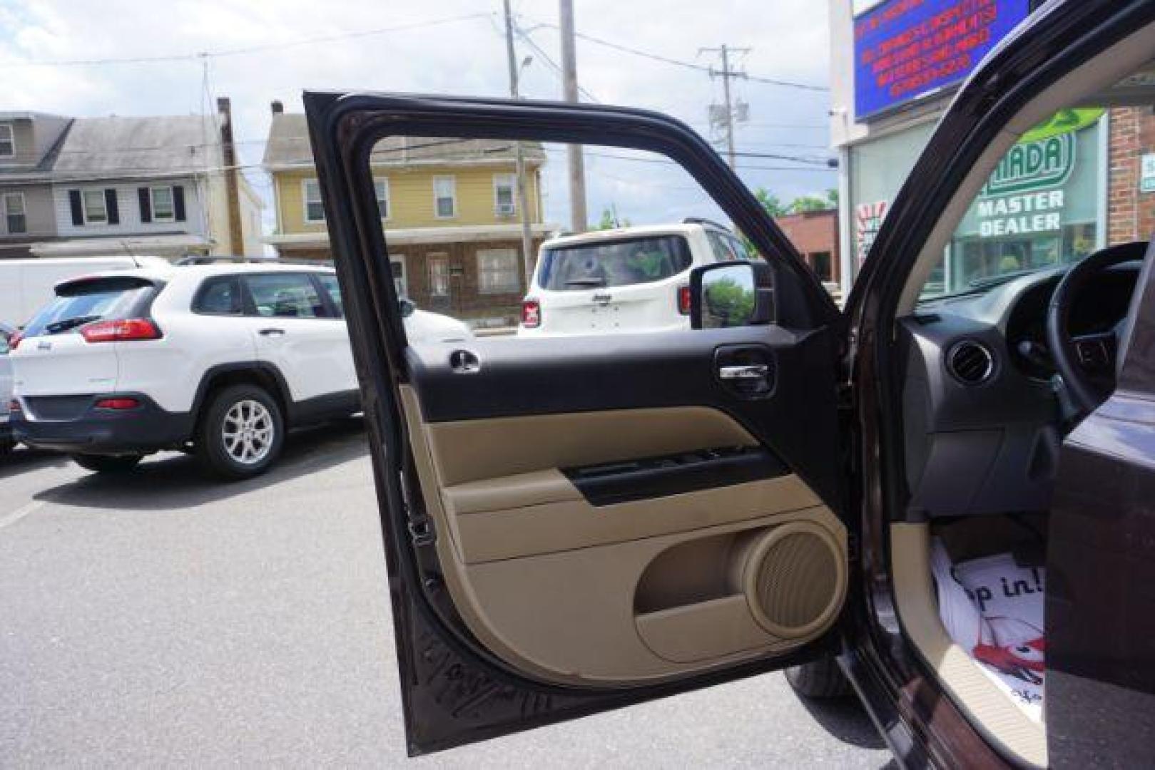 2014 Rugged Brown Pearlcoat /Light Pebble Beige/Dk Slate Jeep Patriot Latitude 4WD (1C4NJRFB3ED) with an 2.4L L4 DOHC 16V engine, Continuously Variable Transmission transmission, located at 312 Centre Ave, Schuylkill Haven, PA, 17972, (570) 593-5278, 40.638130, -76.177383 - Boston Accoustics stereo, locking/limited slip differential, power sunroof - Photo#17