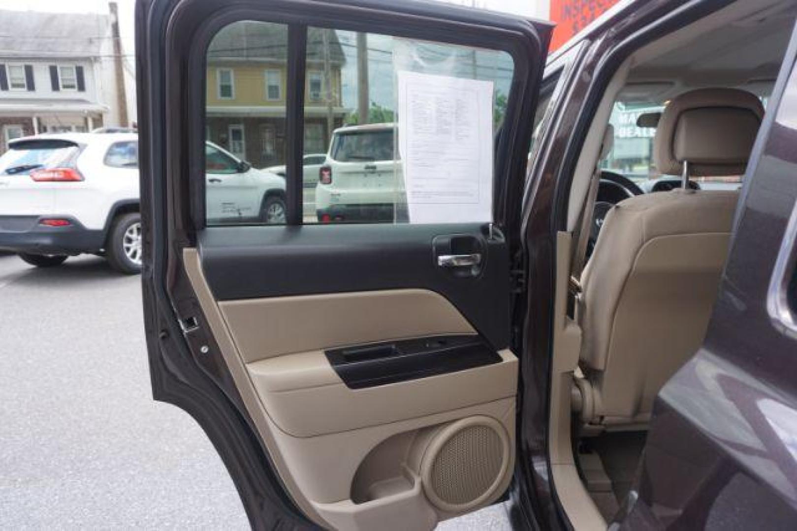 2014 Rugged Brown Pearlcoat /Light Pebble Beige/Dk Slate Jeep Patriot Latitude 4WD (1C4NJRFB3ED) with an 2.4L L4 DOHC 16V engine, Continuously Variable Transmission transmission, located at 312 Centre Ave, Schuylkill Haven, PA, 17972, (570) 593-5278, 40.638130, -76.177383 - Boston Accoustics stereo, locking/limited slip differential, power sunroof - Photo#30